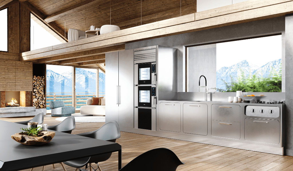 Unox Casa Model 1 in a stainless steel kitchen inside a mountain chalet