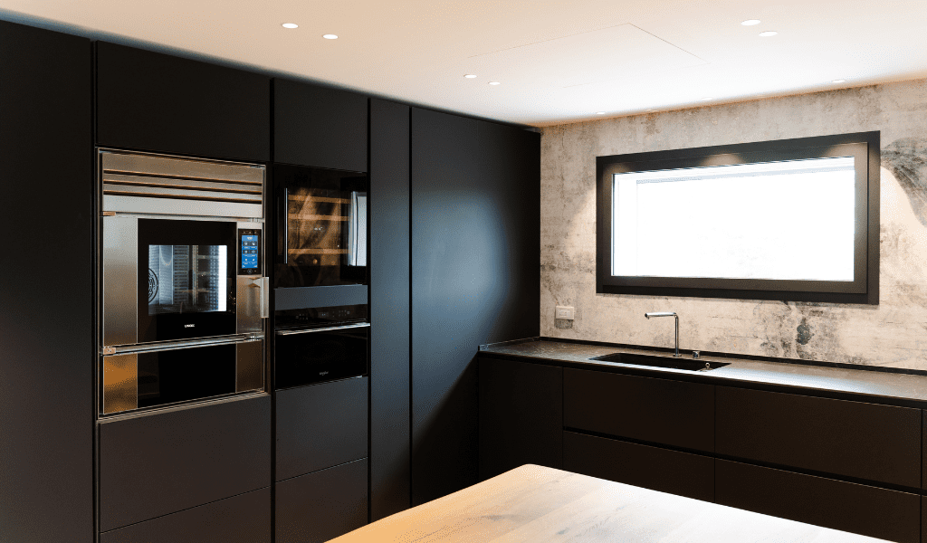 Unox Casa Model 1S in a dark-toned corner kitchen